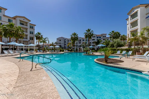 a swimming pool with outdoor seating and yard