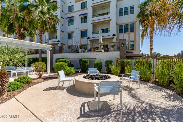 a view of a patio with table and chairs and potted plants