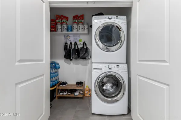 a utility room with sink dryer and washer