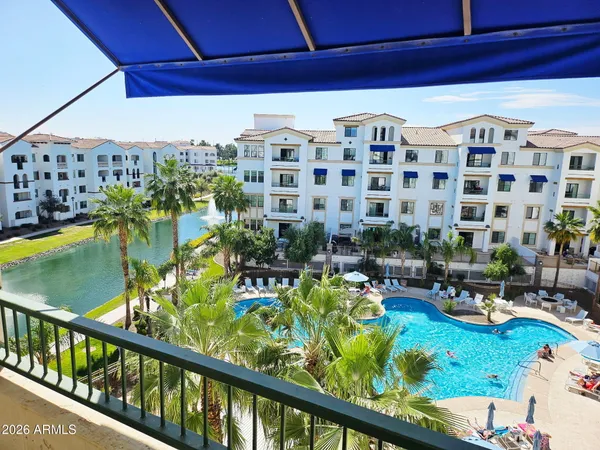 a view of swimming pool with outdoor seating