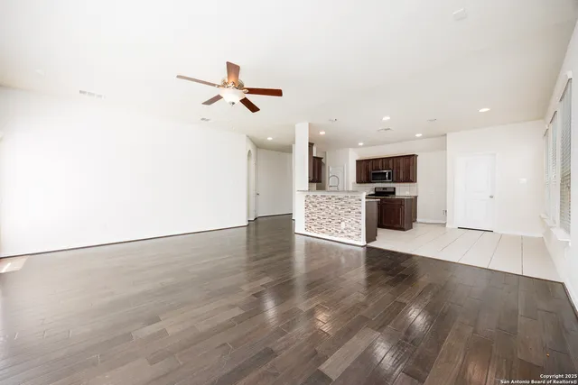 a view of a kitchen with a sink and a stove top oven