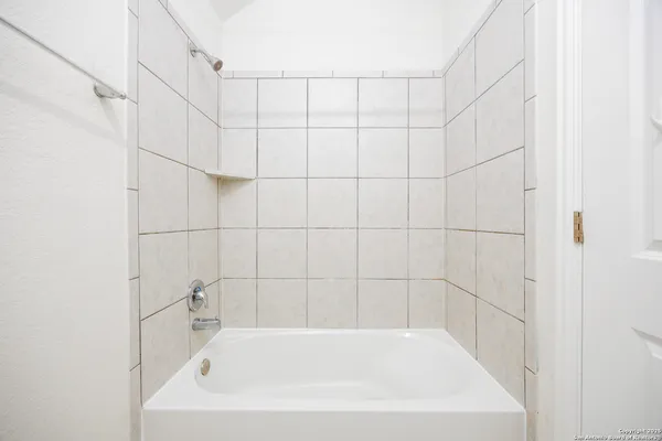 a bathroom with a bathtub