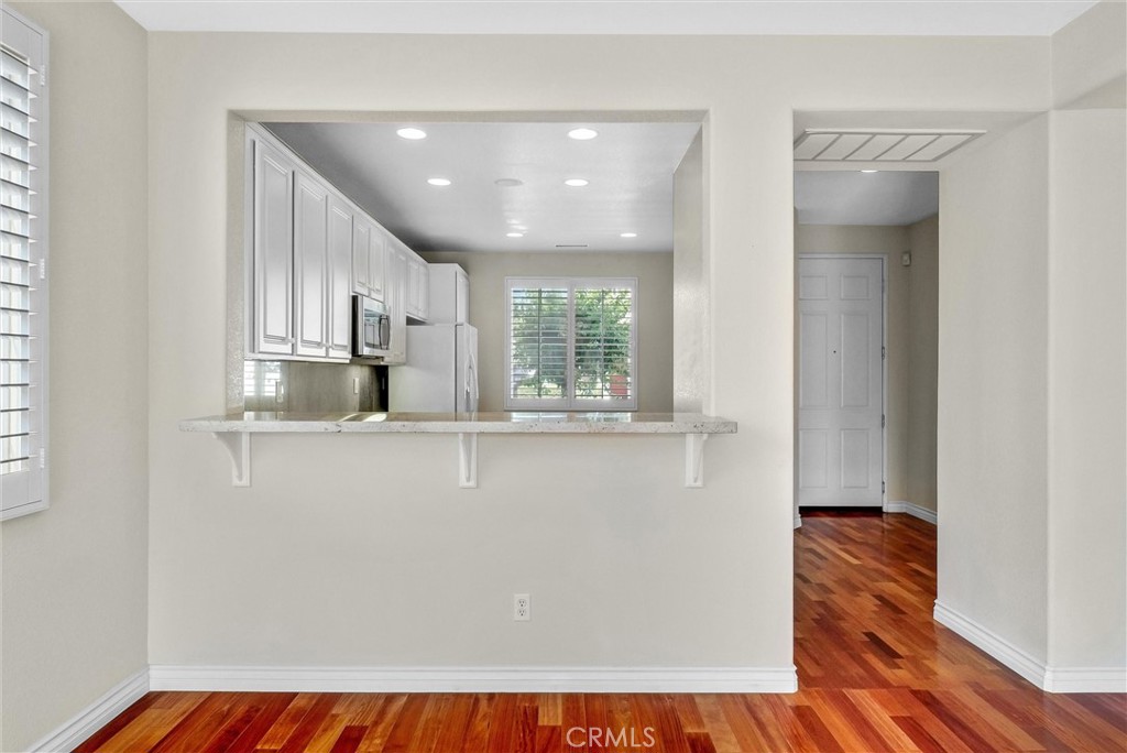698 Legacy Drive Brea, CA 92821 - Photo 11 of 48 a view of empty room with wooden floor and window