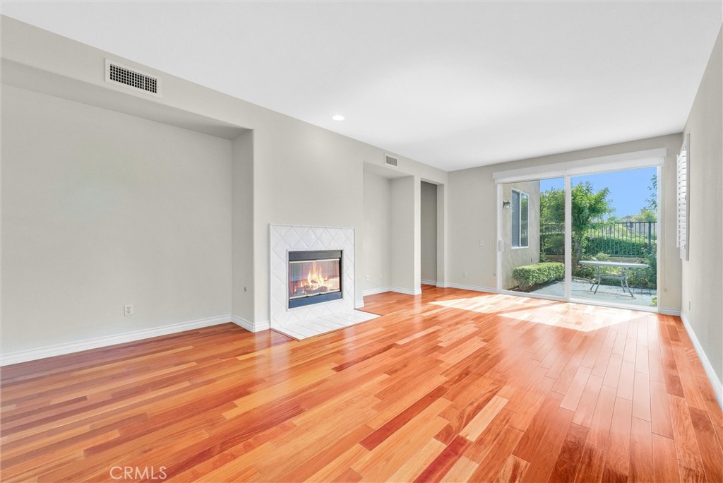 698 Legacy Drive Brea, CA 92821 - Photo 14 of 48 a view of empty room with wooden floor and fan