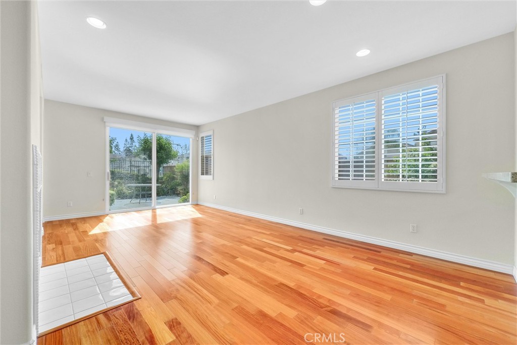 698 Legacy Drive Brea, CA 92821 - Photo 15 of 48 a view of an empty room with wooden floor and a window