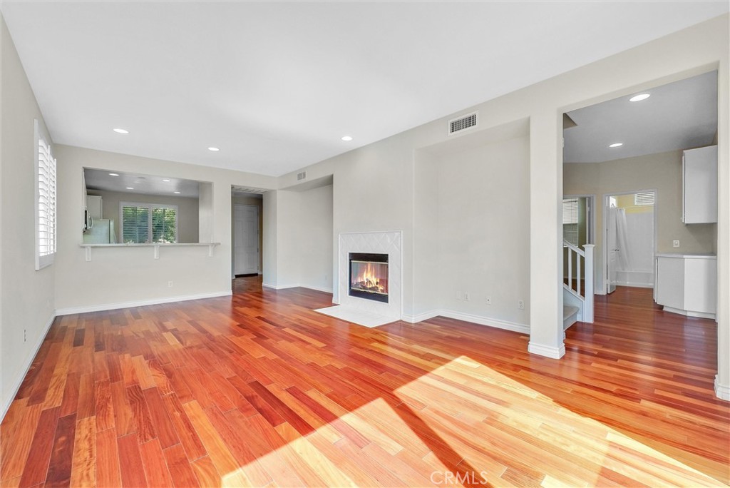 698 Legacy Drive Brea, CA 92821 - Photo 17 of 48 a view of empty room with wooden floor and windows