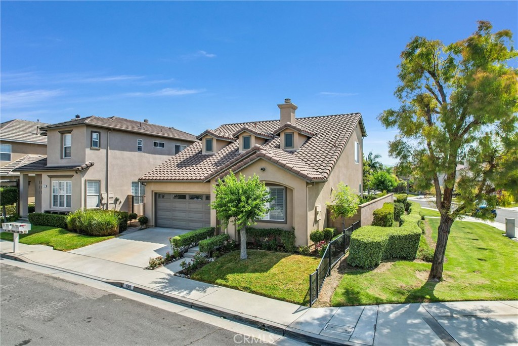 698 Legacy Drive Brea, CA 92821 - Photo 2 of 48 a front view of a house with garden