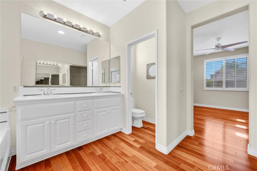 698 Legacy Drive Brea, CA 92821 - Photo 23 of 48 a spacious bathroom with a shower a sink and a mirror