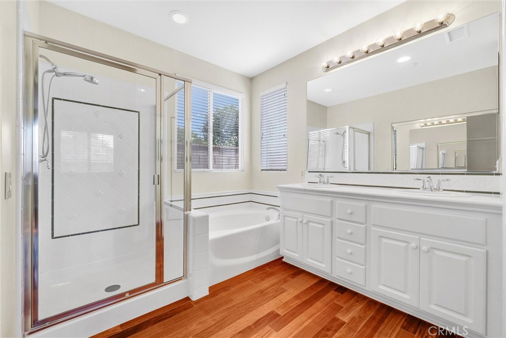 698 Legacy Drive Brea, CA 92821 - Photo 24 of 48 a spacious bathroom with a granite countertop sink mirror and bathtub