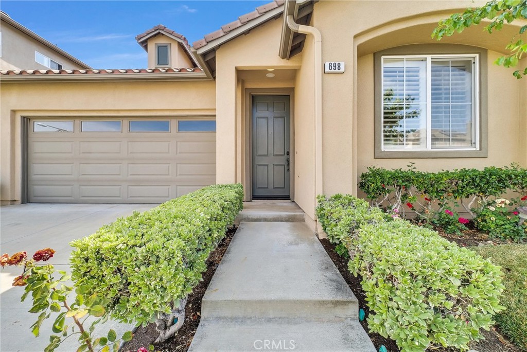 698 Legacy Drive Brea, CA 92821 - Photo 3 of 48 a front view of a house with a garage