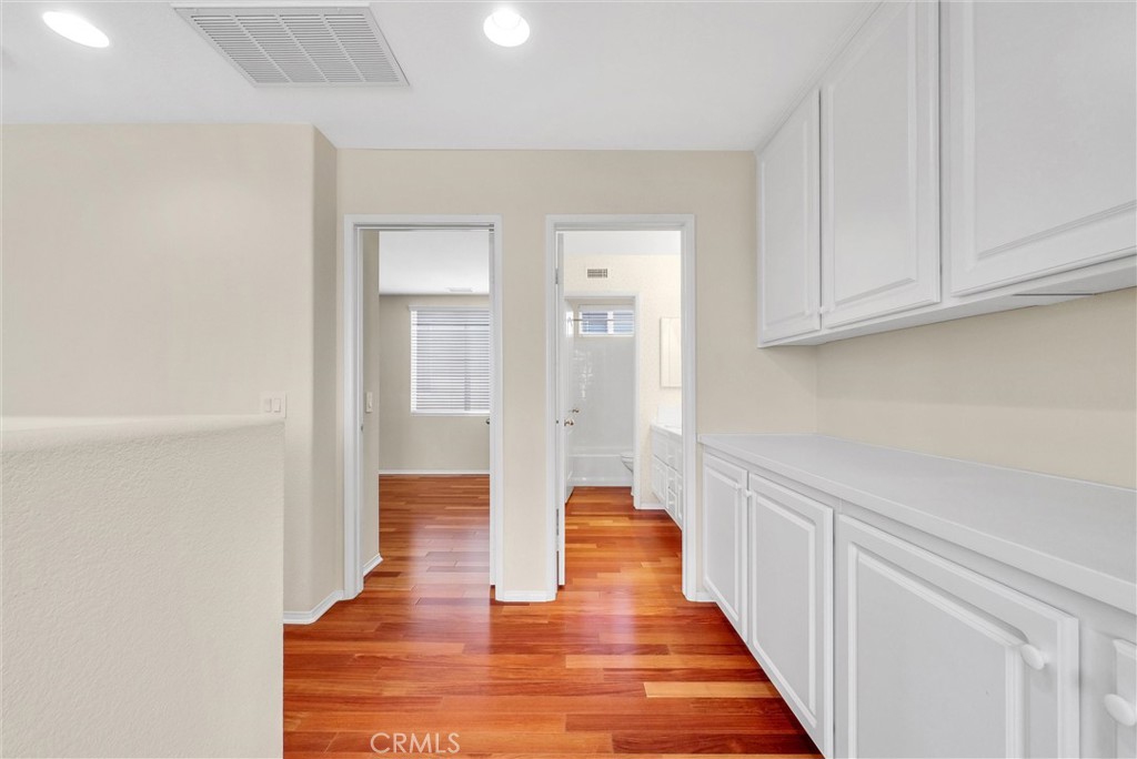 698 Legacy Drive Brea, CA 92821 - Photo 35 of 48 a hallway with wooden floor