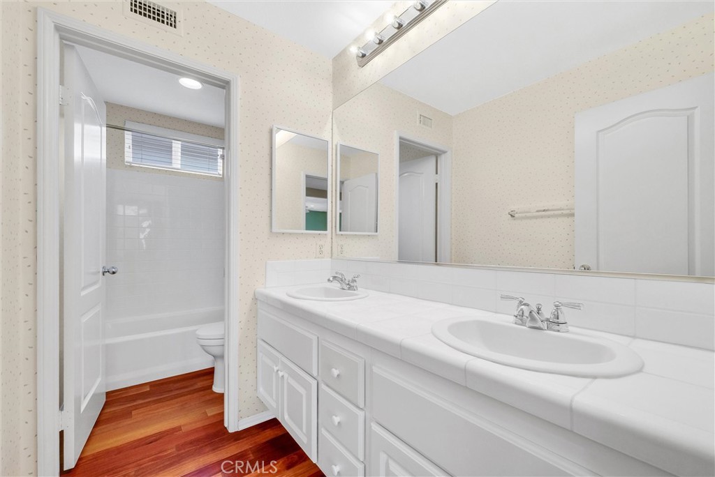 698 Legacy Drive Brea, CA 92821 - Photo 37 of 48 a bathroom with a sink and a mirror