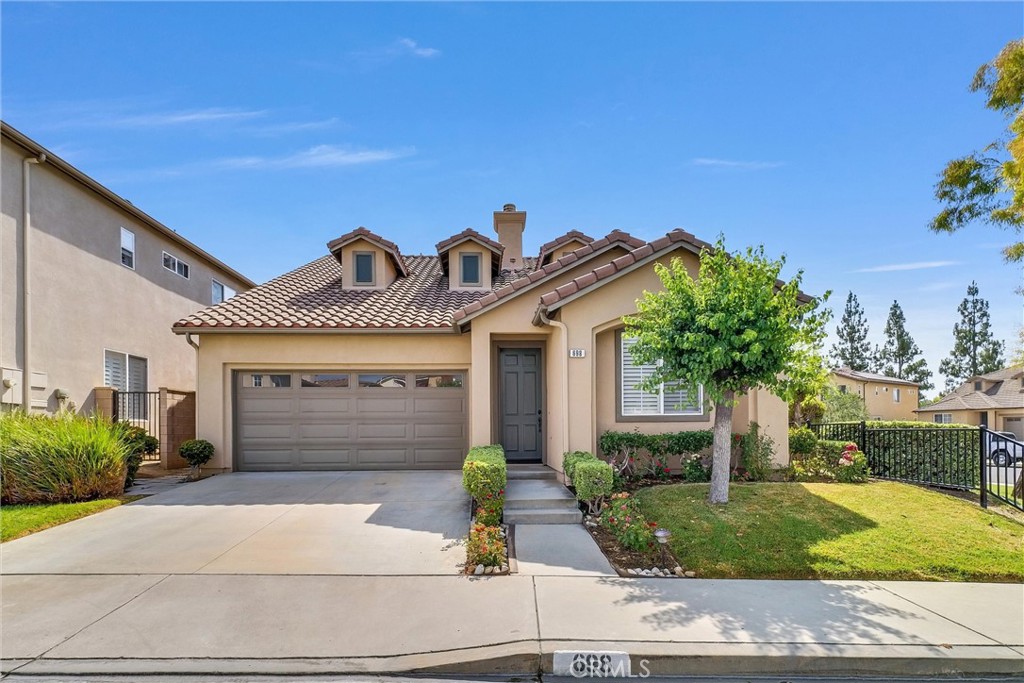698 Legacy Drive Brea, CA 92821 - Photo 41 of 48 a front view of a house with garden