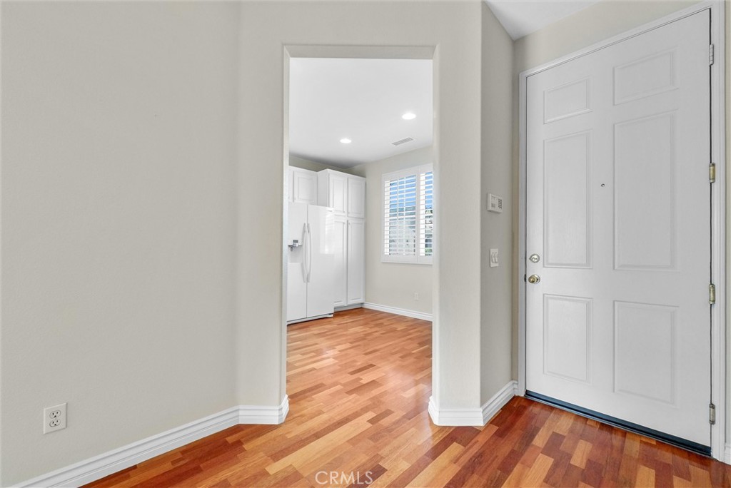 698 Legacy Drive Brea, CA 92821 - Photo 5 of 48 an empty room with wooden floor and windows