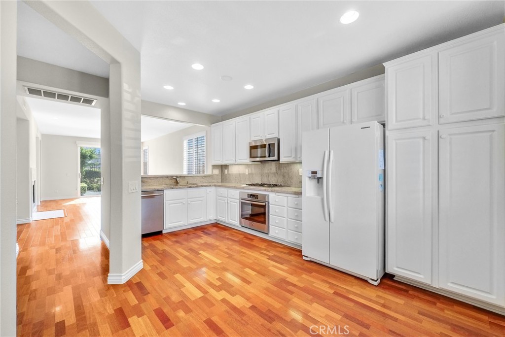 698 Legacy Drive Brea, CA 92821 - Photo 7 of 48 a kitchen with stainless steel appliances a refrigerator sink and microwave
