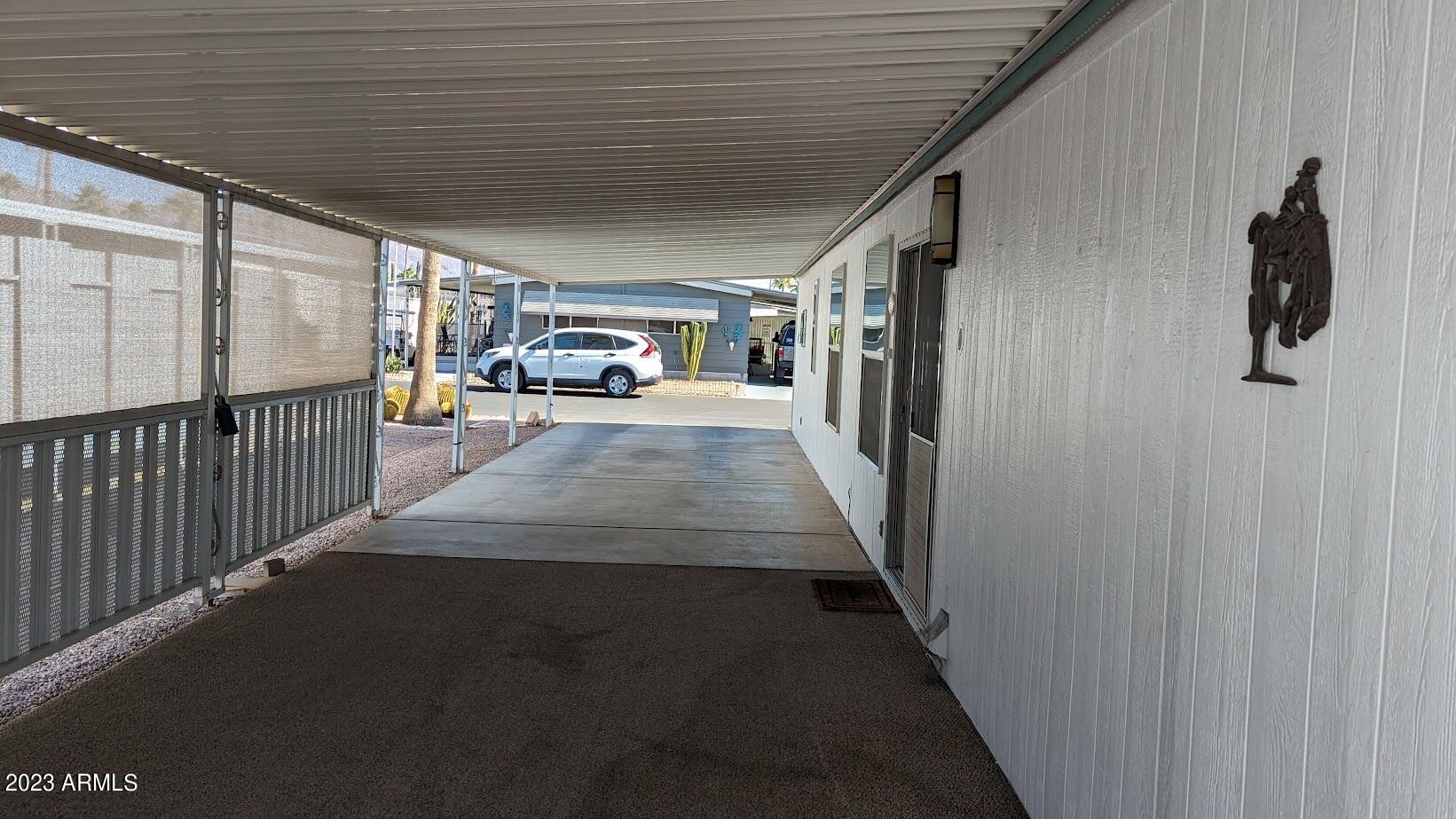 2605 South Tomahawk Road, Unit 116 Apache Junction, AZ 85119 - Photo 8 of 11 carport