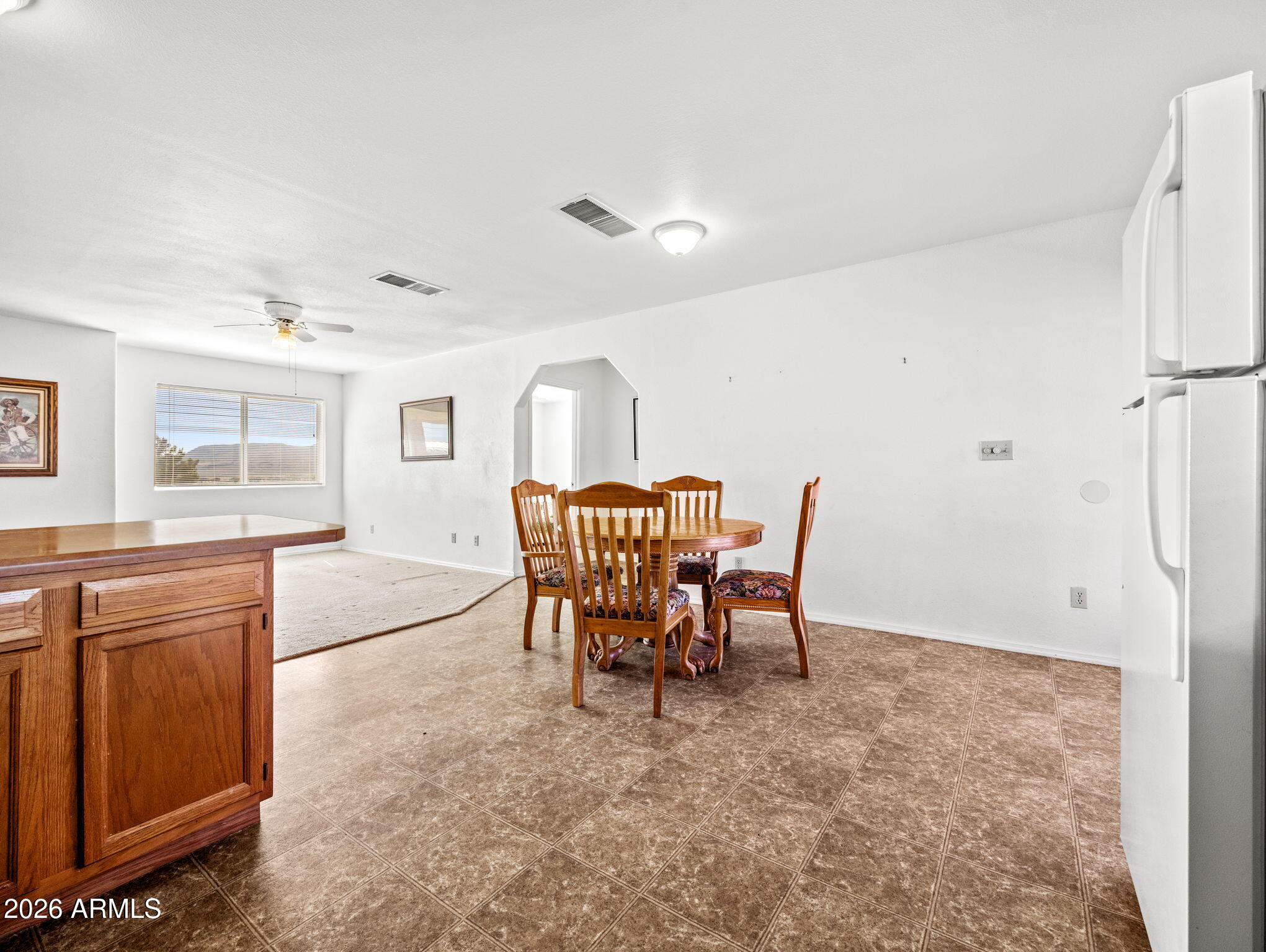 18420 Peeples Valley Road Peeples Valley, AZ 86332 - Photo 15 of 31 a view of a dining room with furniture and a window