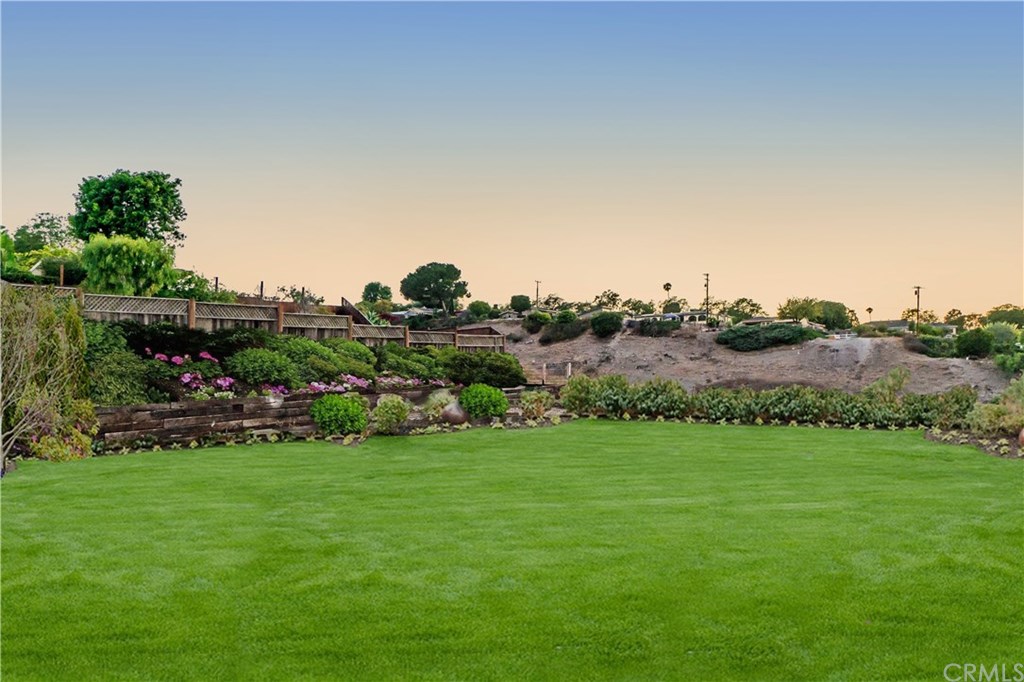 26325 Silver Spur Road Rancho Palos Verdes, CA 90275 - Photo 38 of 48 The backyard has been seeded for grass such as what the picture shows here. This is artist's rendition of when the plants are fully mature.