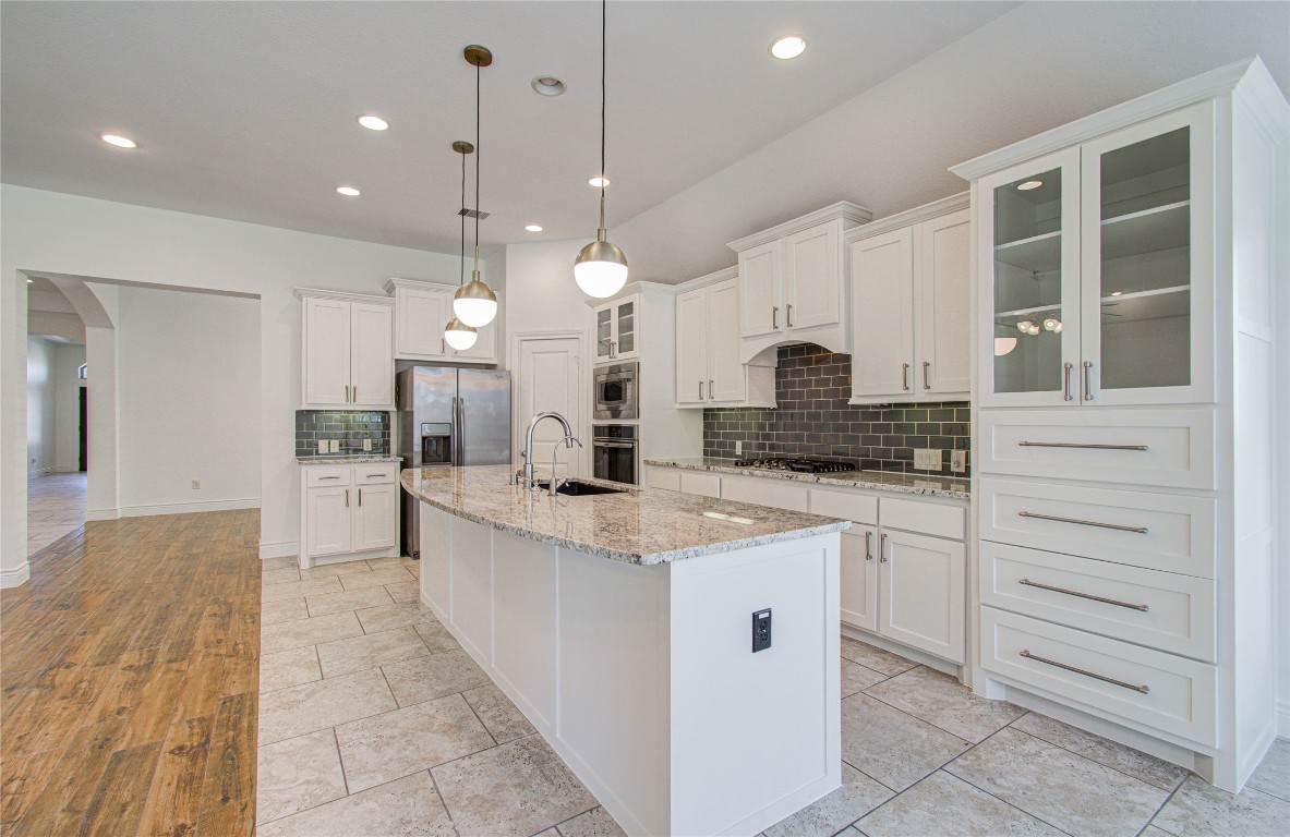 6614 Rising Hills Lane Sugar Land, TX 77479 - Photo 14 of 28 a large kitchen with cabinets