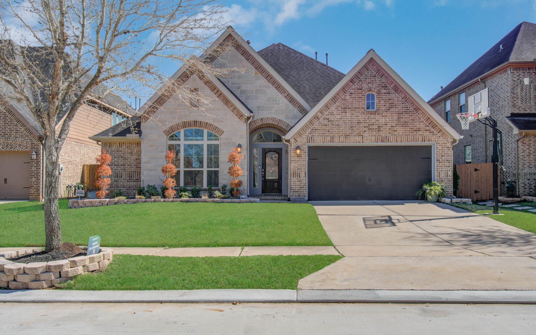 6614 Rising Hills Lane Sugar Land, TX 77479 - Photo 2 of 28 a front view of a house with a yard and garage