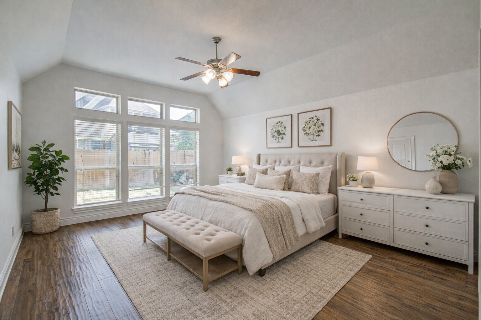 6614 Rising Hills Lane Sugar Land, TX 77479 - Photo 22 of 28 a spacious bedroom with a large bed and a chandelier