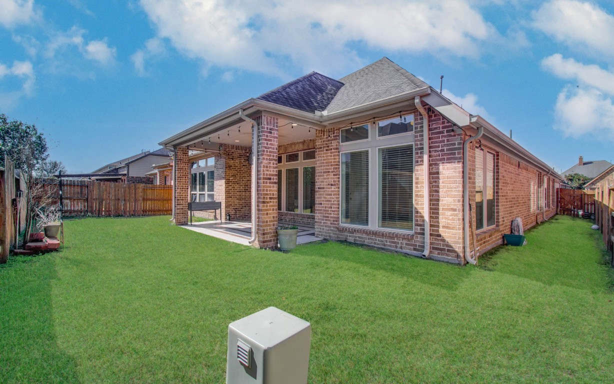 6614 Rising Hills Lane Sugar Land, TX 77479 - Photo 27 of 28 a view of a house with backyard and porch