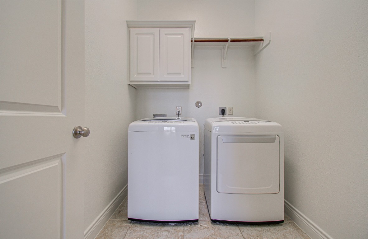 6614 Rising Hills Lane Sugar Land, TX 77479 - Photo 28 of 28 a utility room with dryer and washer