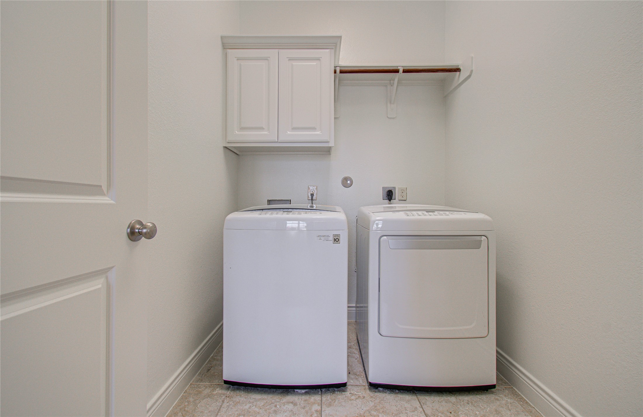 6614 Rising Hills Lane Sugar Land, TX 77479 - Photo 28 of 28 a utility room with dryer and washer