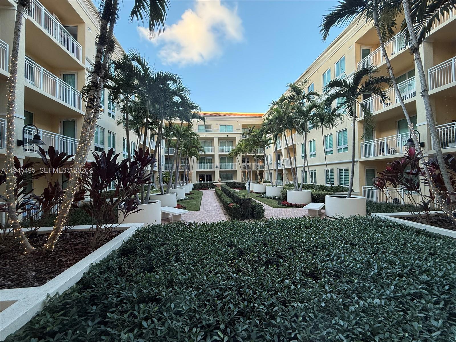 7350 Southwest 89th Street, Unit 1908S Miami, FL 33156 - Photo 26 of 28 a view of a building with a garden
