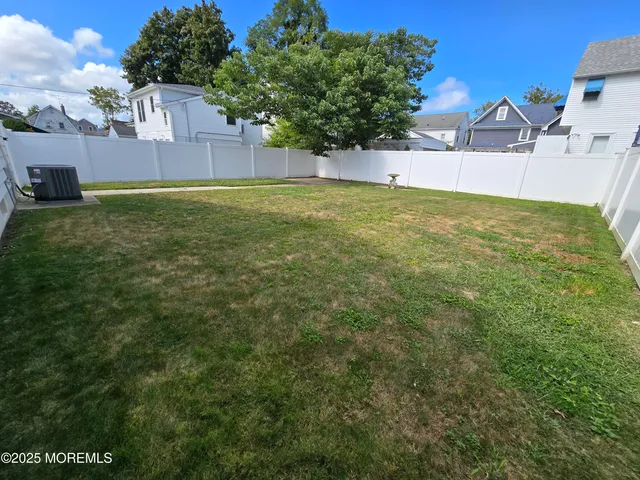 a view of a house with a big yard