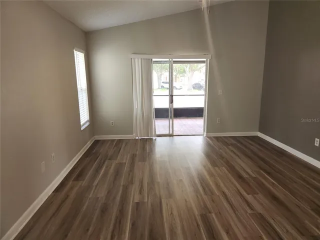 a view of a livingroom with wooden floor