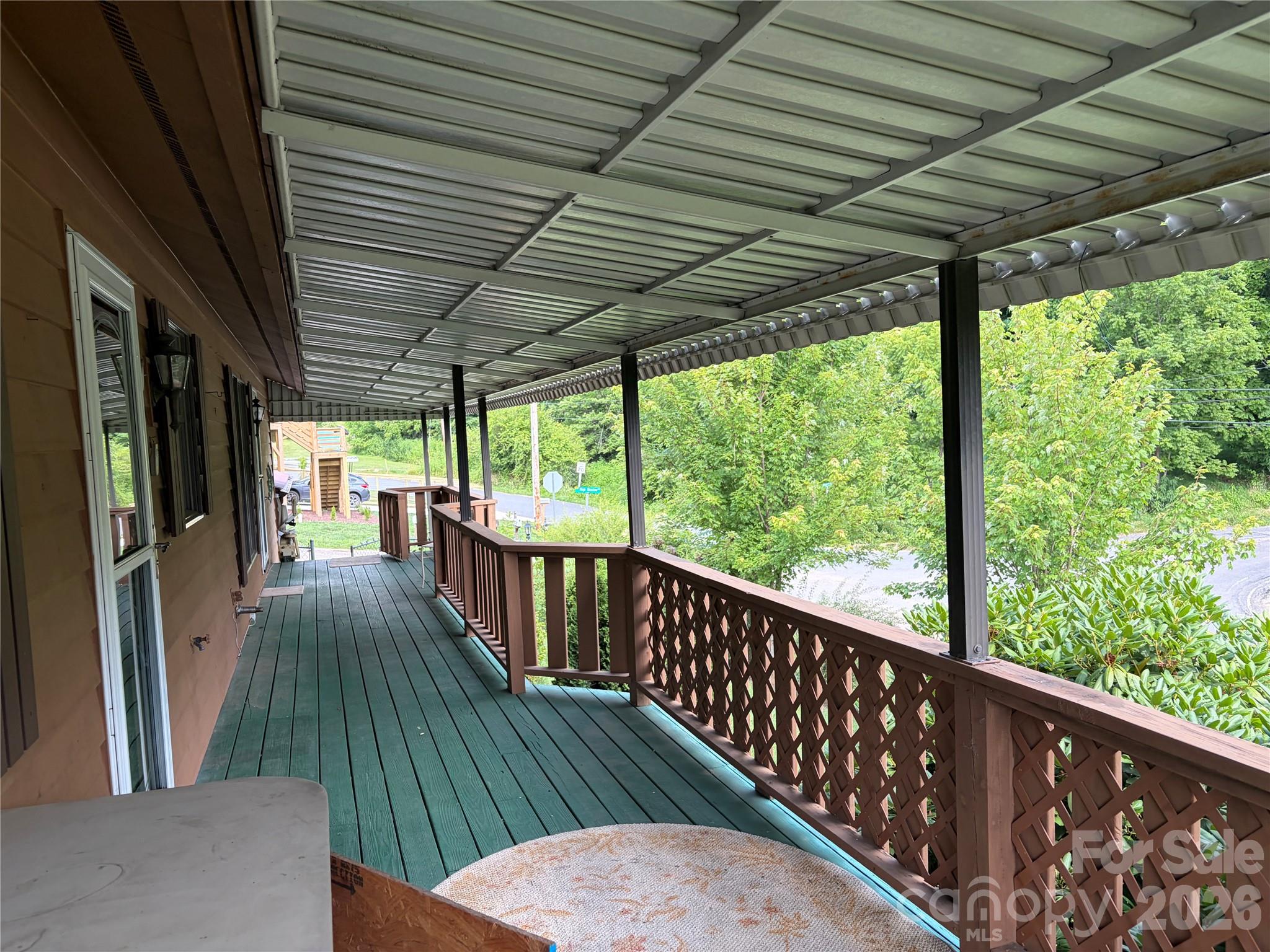256 A Bruce Road Mars Hill, NC 28754 - Photo 16 of 39 a view of porch with wooden floor in outdoor space