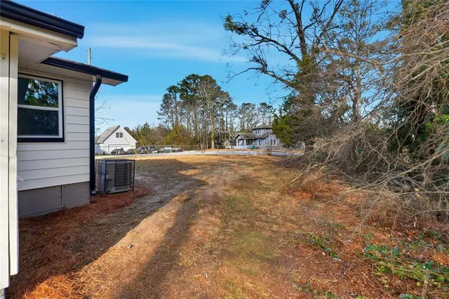 a view of a backyard of the house