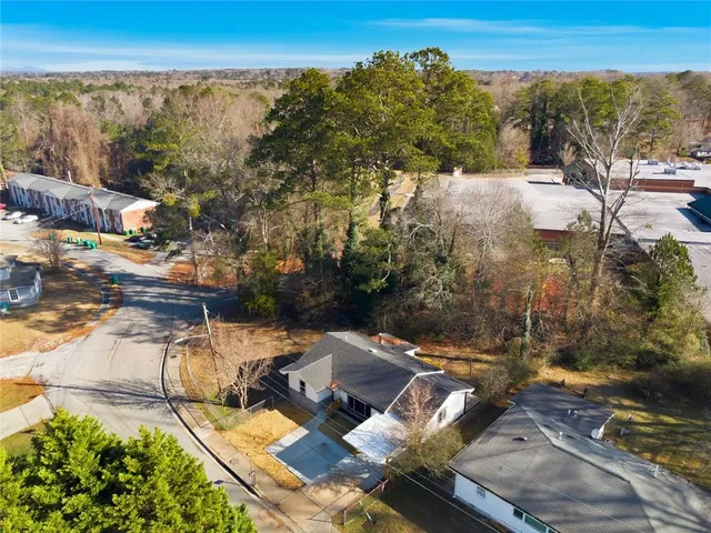 an outdoor view of the house with green space