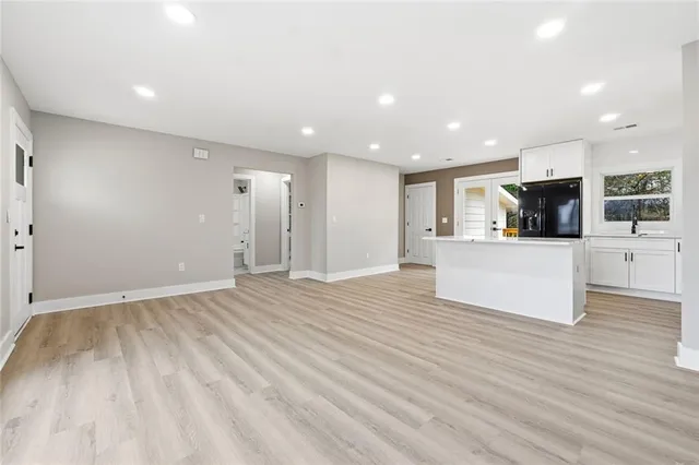 a view of a kitchen with microwave and cabinets