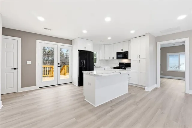 a view of kitchen with cabinets and stainless steel appliances