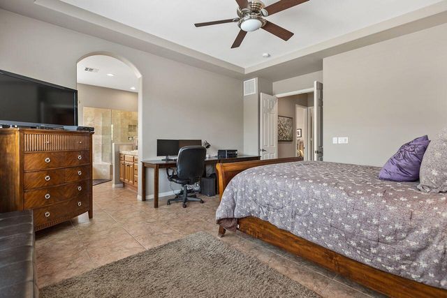 a bedroom with a bed and furniture