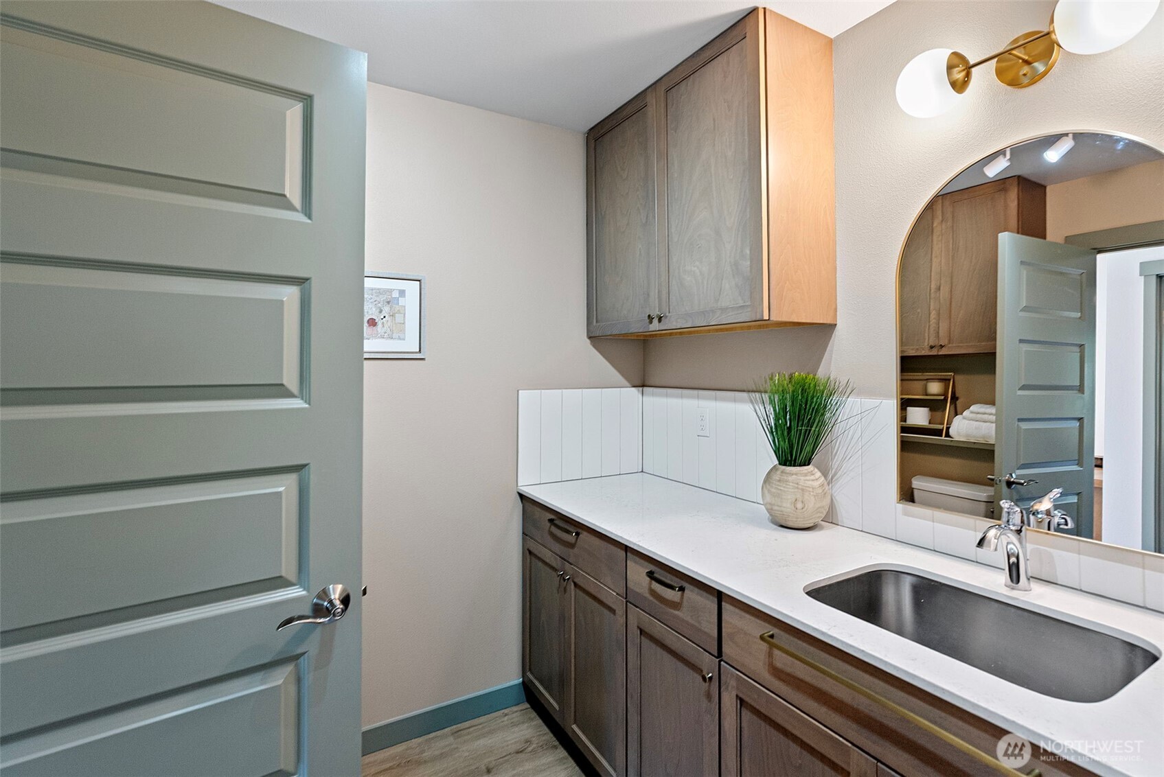 503 5th Street Steilacoom, WA 98388 - Photo 21 of 40 a kitchen with a sink and a refrigerator