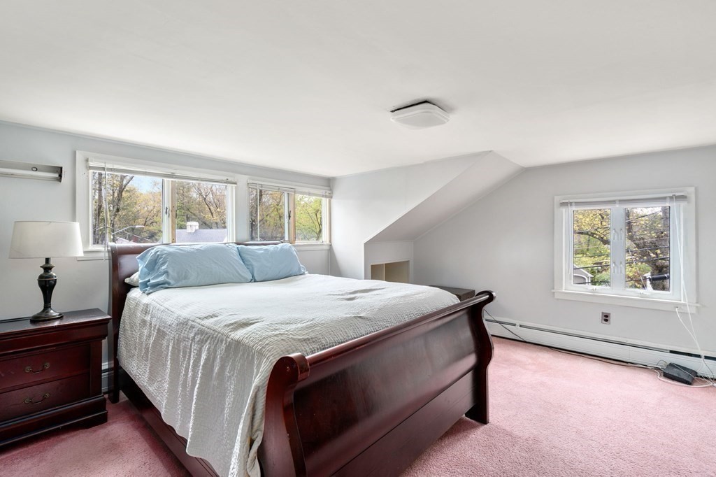 73 Beverly Road Chestnut Hill, MA 02467 - Photo 15 of 21 a bedroom with a bed and a window