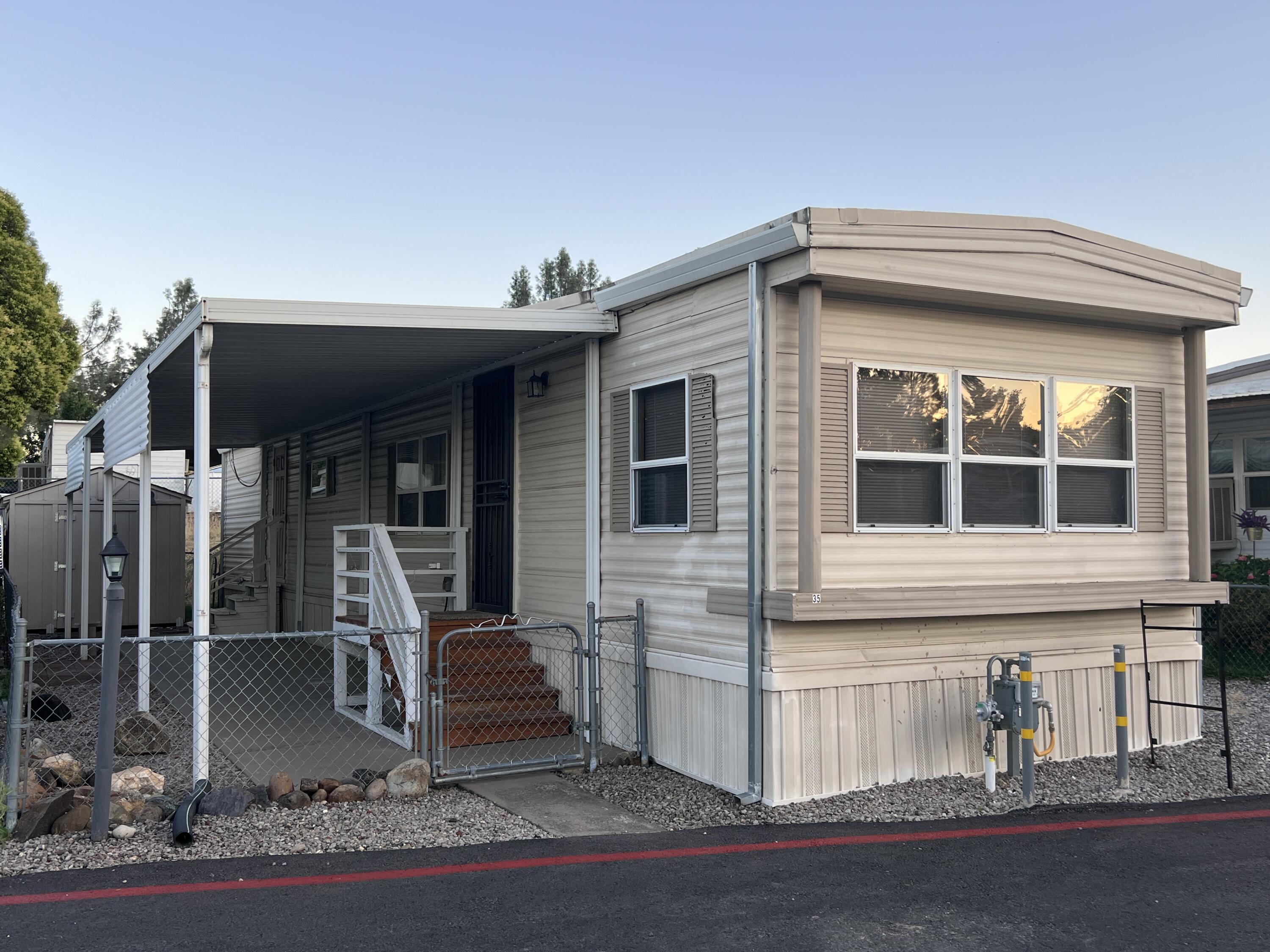 481 Twin View Boulevard, Unit 35 Redding, CA 96003 - Photo 1 of 17 a view of a house with a yard