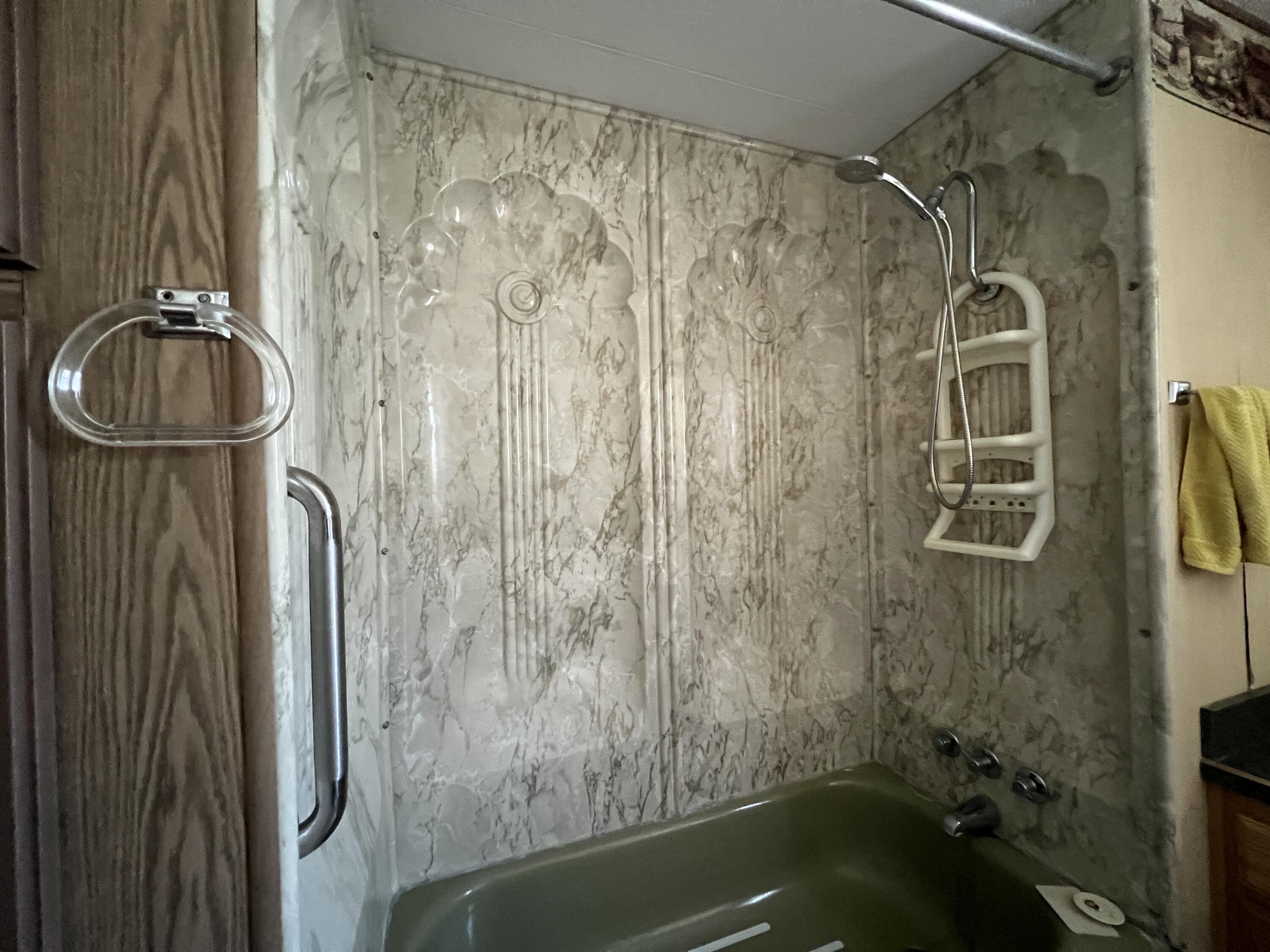 481 Twin View Boulevard, Unit 35 Redding, CA 96003 - Photo 11 of 17 a bathroom with a bathtub and shower