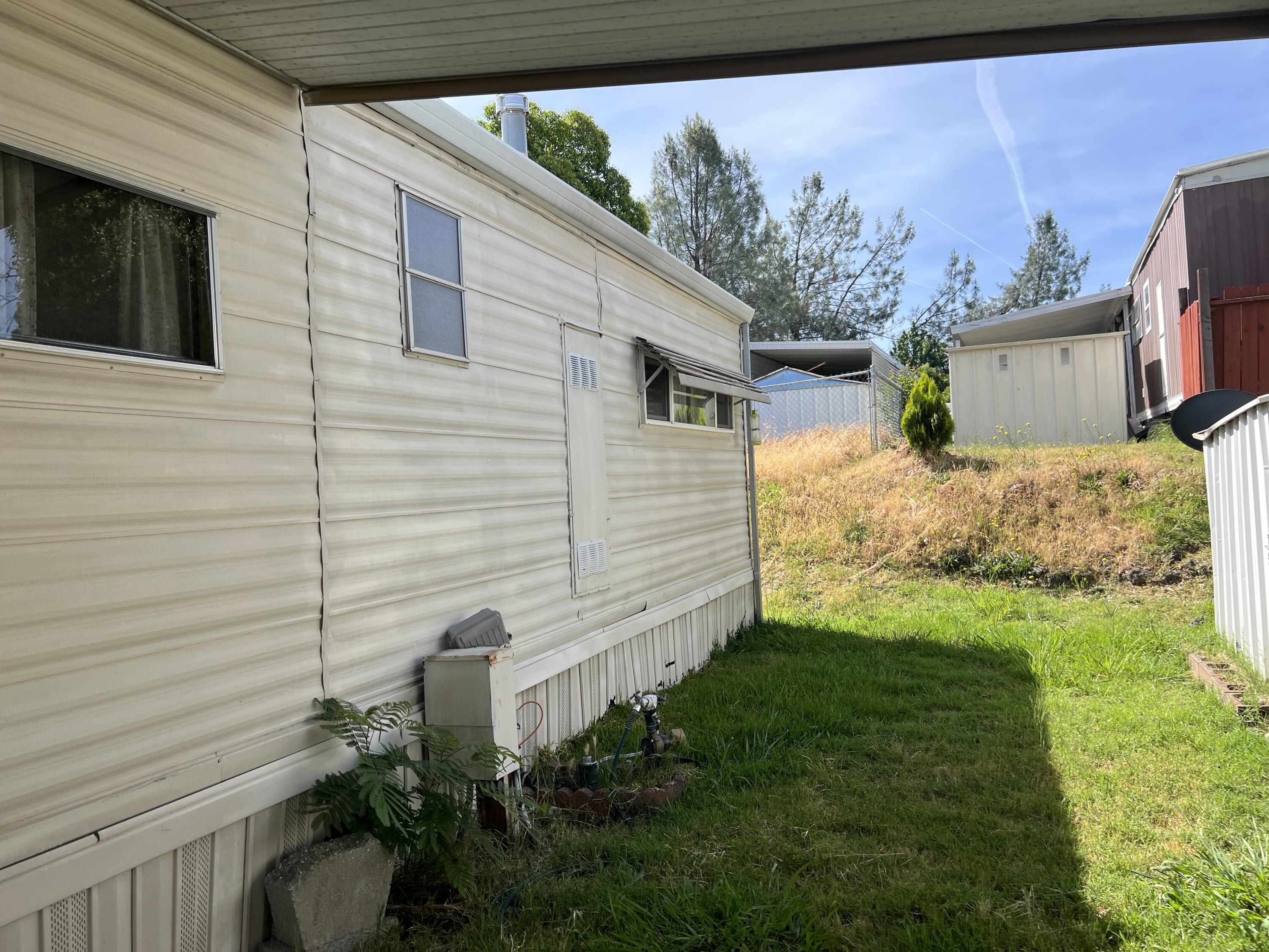481 Twin View Boulevard, Unit 35 Redding, CA 96003 - Photo 15 of 17 a view of a backyard with plants