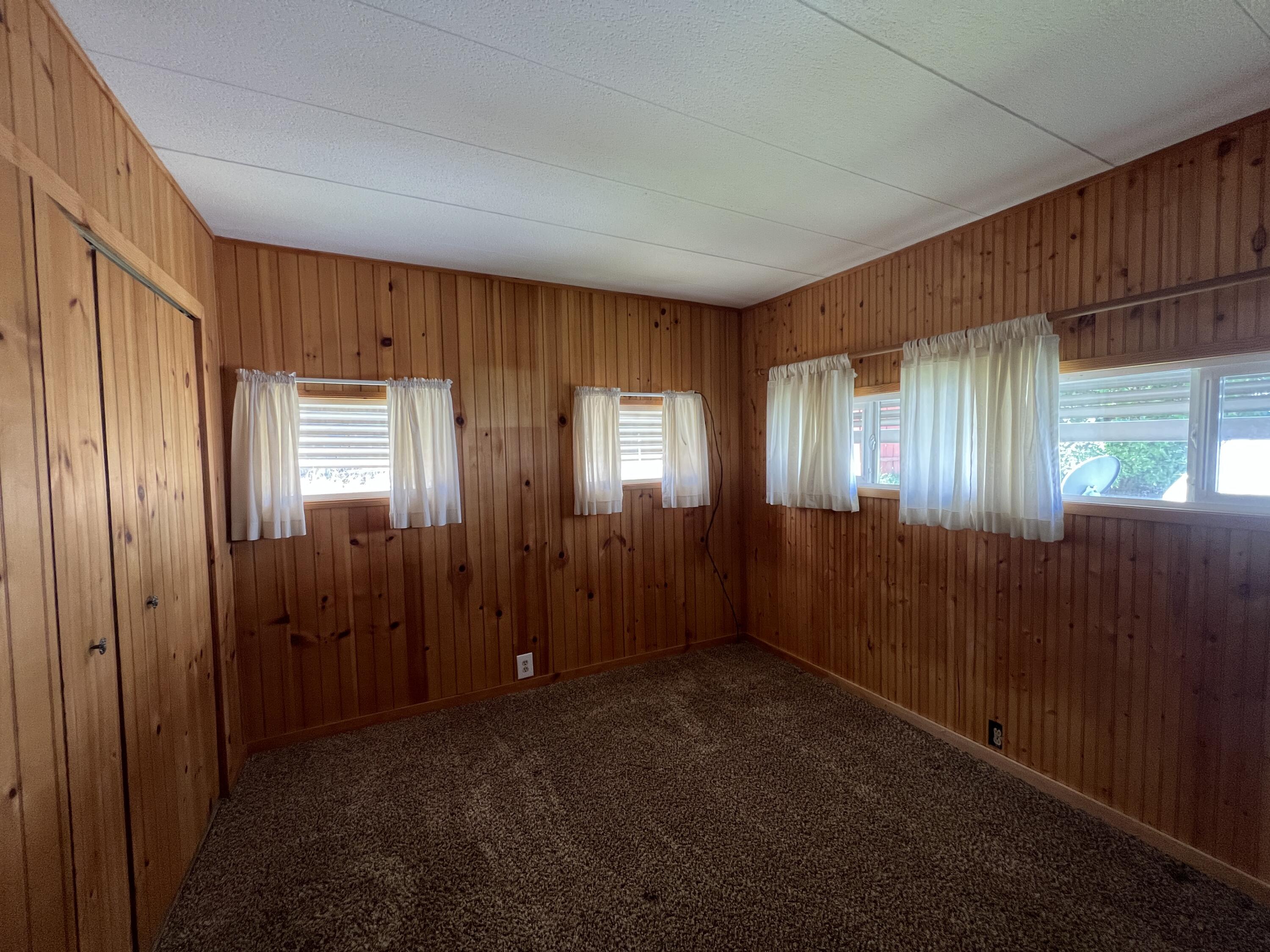 481 Twin View Boulevard, Unit 35 Redding, CA 96003 - Photo 7 of 17 a view of an empty room with windows and closet