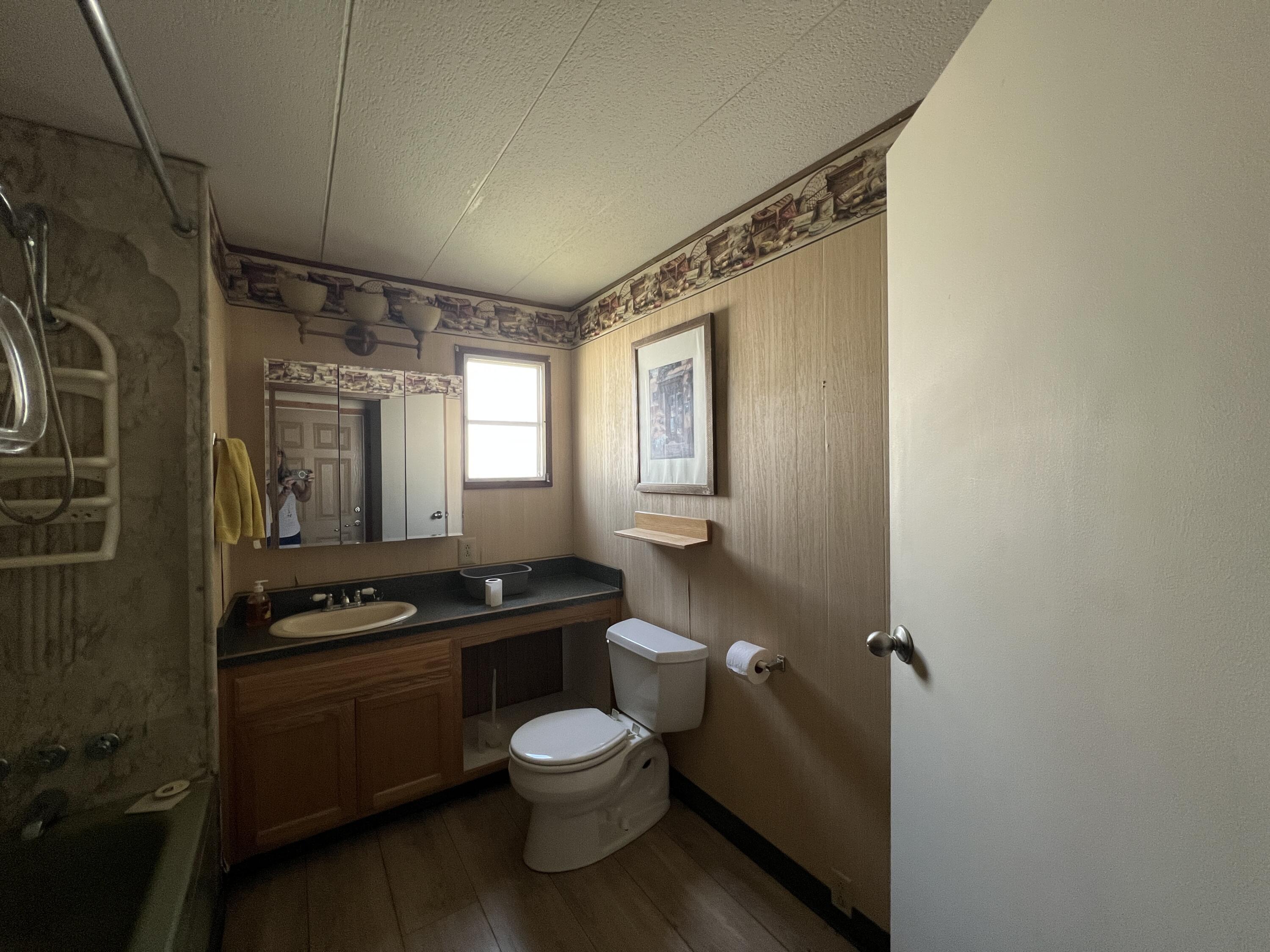 481 Twin View Boulevard, Unit 35 Redding, CA 96003 - Photo 10 of 17 a bathroom with a sink a toilet and shower