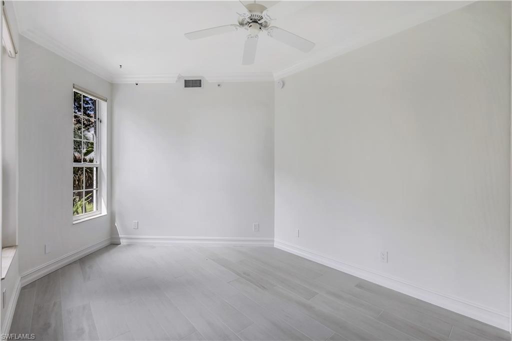 217 Colonade Circle Naples, FL 34103 - Photo 29 of 40 a view of an empty room with a window