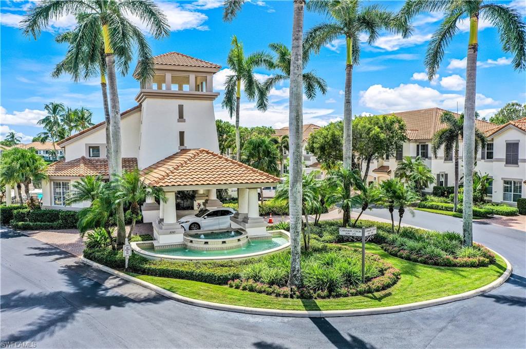 217 Colonade Circle Naples, FL 34103 - Photo 36 of 40 a front view of a house with swimming pool