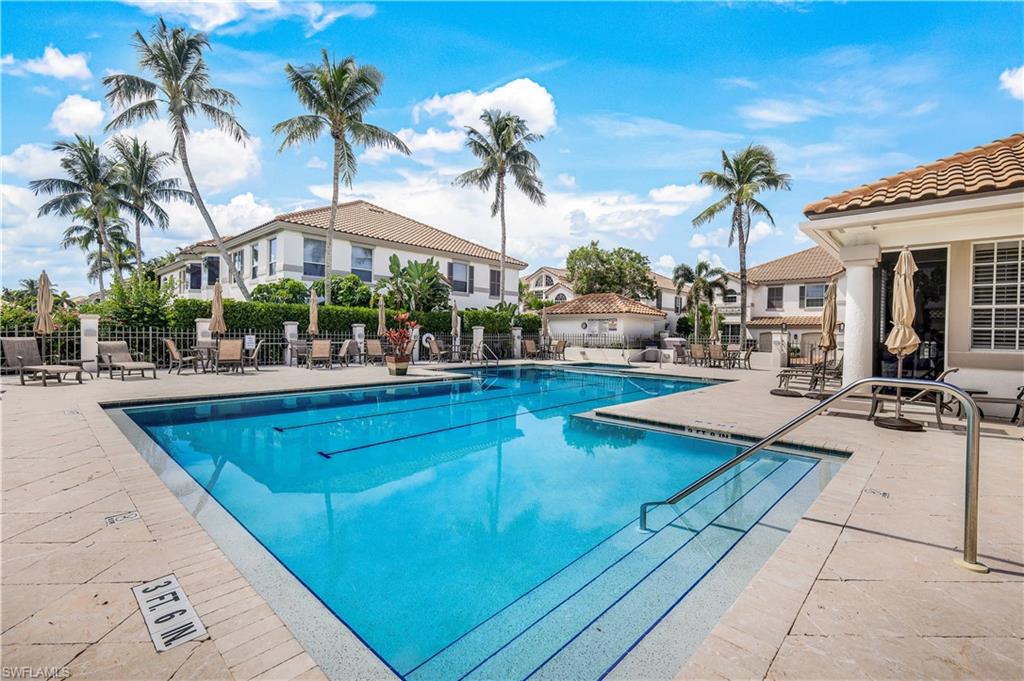 217 Colonade Circle Naples, FL 34103 - Photo 37 of 40 a view of a patio with swimming pool table and chairs