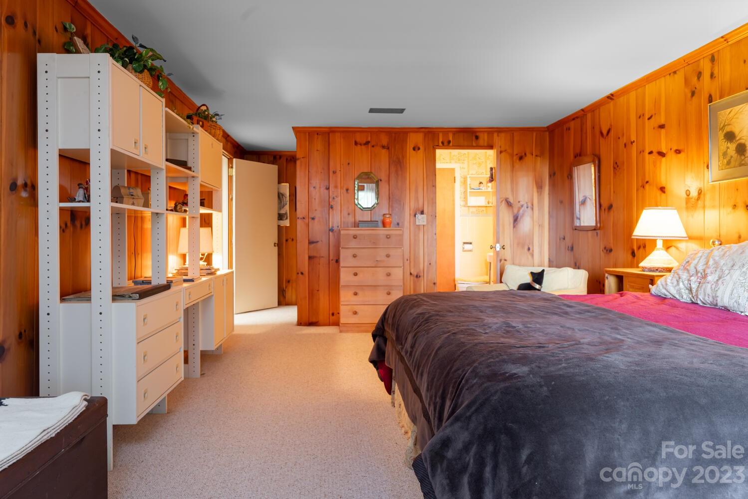 1715 Hogback Mountain Road Tryon, NC 28782 - Photo 34 of 44 a spacious bedroom with a large bed and a large window