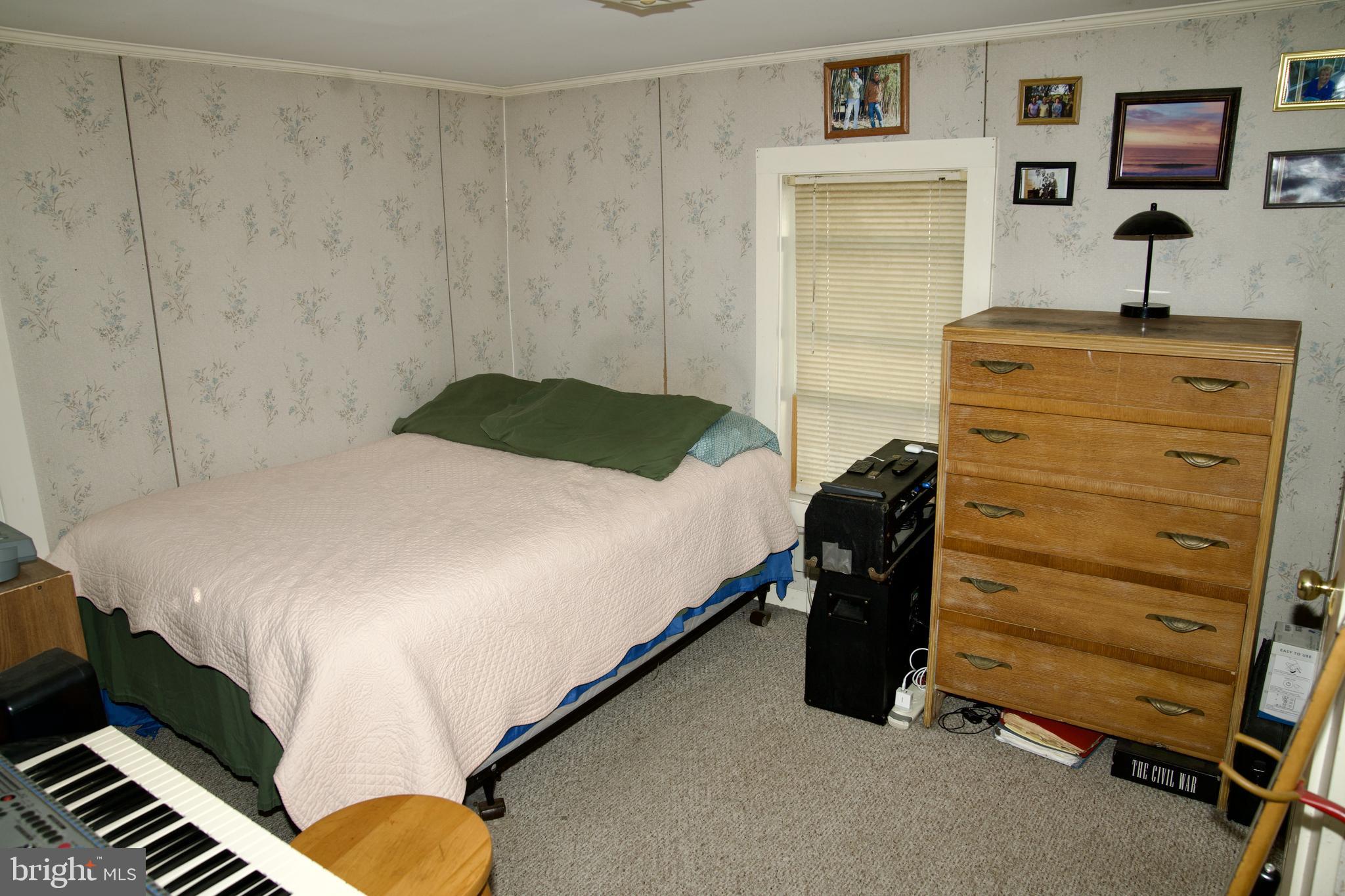 31867 Shavox Road Salisbury, MD 21804 - Photo 19 of 64 a bedroom with a bed and a dresser