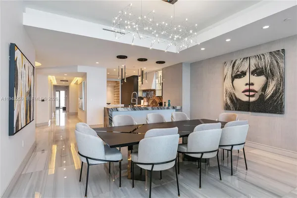 a bedroom with furniture and a large window